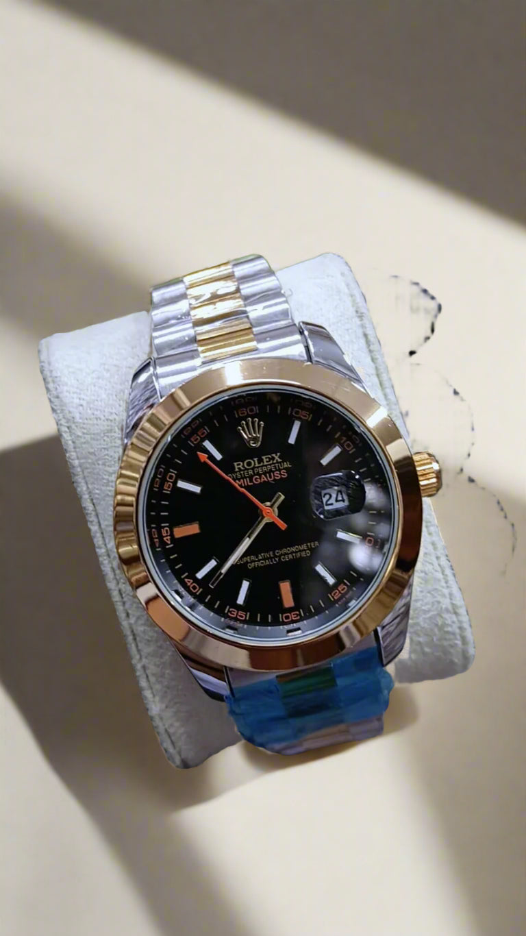 Rolex watch with a gold and silver case on a white cloth with a blurred background